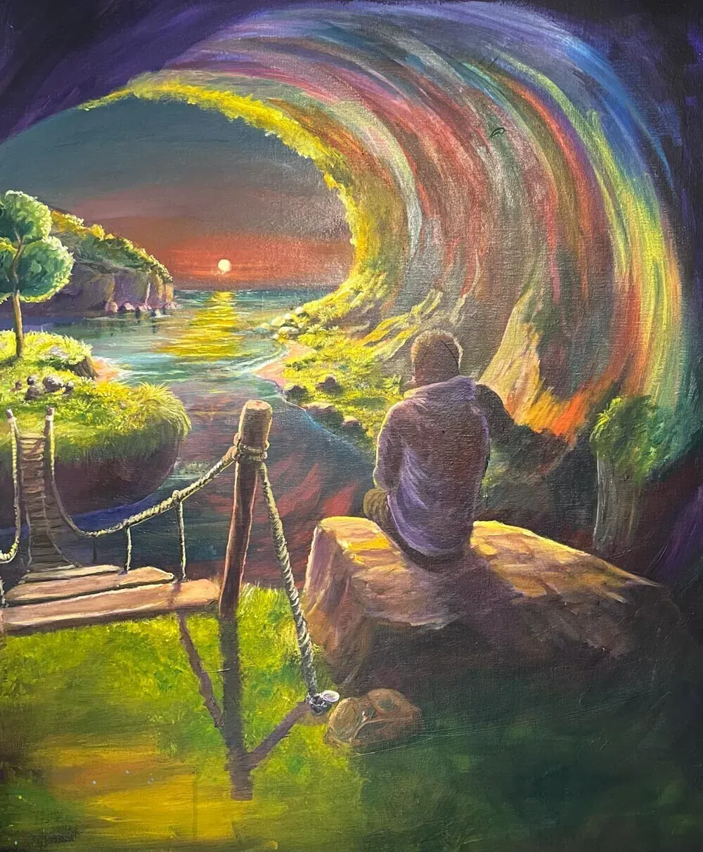 A person sits on a rock beside a rope bridge, looking out through an arching rainbow-coloured wave towards a sunset over the sea.